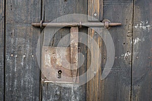 Closeup vintage door lock of external antique wooden door of Country house