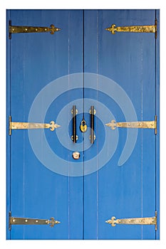 Closeup a vintage key locked on a blue color wooden door