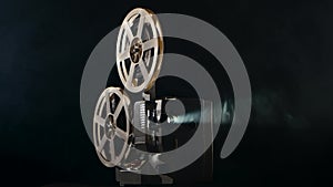 Closeup of a vintage movie projector. Projection rays in move