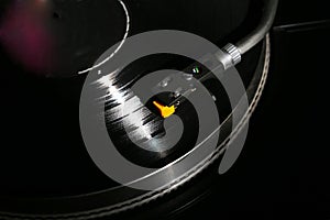 Closeup of vinyl turntable, hi-fi headshell cartridge in action, Retro gramophone playing analog disc with music. place