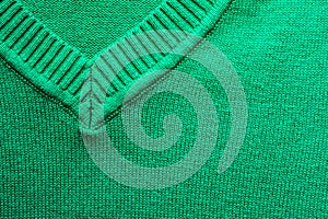 Closeup of virid knitted woolen fabric texture