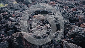 Closeup on volcanic stones on ground