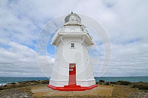 Closeup from Waipapa Point Lighthouse cloudy skya Point Lighthouse with a cloudy sky