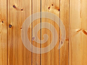 Closeup of a wall made of wooden planks with detailed wood grain