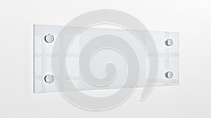 Closeup of wall-mounted blank glass nameplate.
