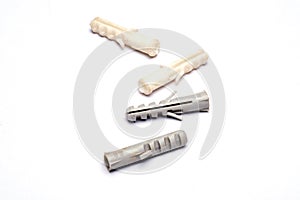 Closeup of wall nail nylon plugs in white background