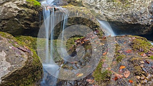 closeup water cascade fall over a stones