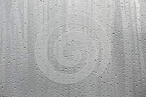 Closeup water condensation on window glass background photo