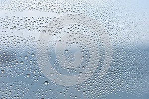 Closeup water droplets on frosted glass thick film for reduces visibility across. Toilet wall sticker bathroom decoration.