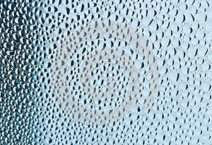 Closeup water drops on the glass plate