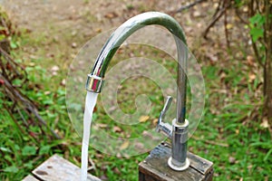 Water running from the faucet in the garden