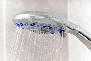 Closeup of water running from shower head