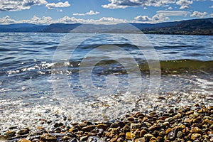 Closeup of Waves Rolling into Beach Shoreline