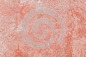 Closeup of a weathered red concrete wall
