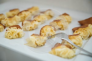 Closeup of wedding table decorations with sweet dessert on the white table