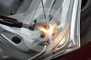 Closeup for welding auto body with gas torch