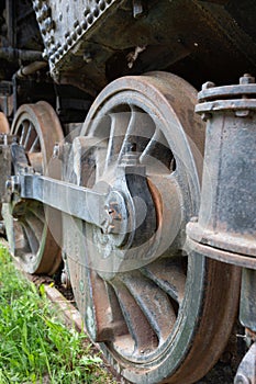 Closeup of a wheel of an old steam engine