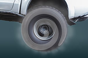 Closeup of the wheels of off-road vehicles that are rotating at high speed