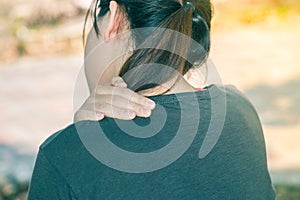 Closeup white asian fitness fatty woman holds her neck