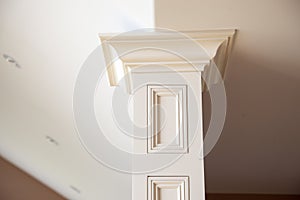 Closeup of a white column inside a home