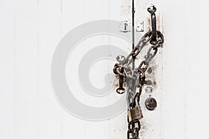 Closeup white door lock old grunge chain hard locking