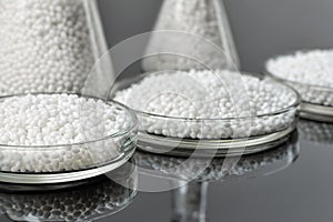 Closeup white granules of a plastic polymer