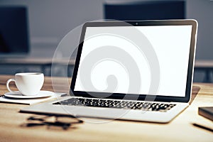 Closeup of white laptop on desktop