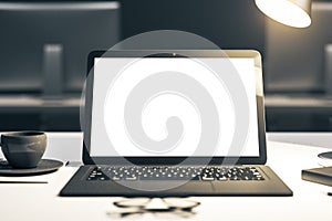 Closeup of white laptop on desktop