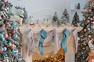 Closeup of white living room with Christmas New year decor,light garland and champagne glass