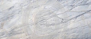 Closeup of white marble flooring pattern resembling snowy winter landscape