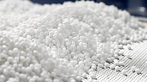 Closeup of a white plastic polymer granule photo