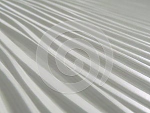 Closeup of white pleated fabric texture