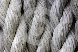 Closeup of white ropes under the lights - a cool picture for backgrounds and wallpapers