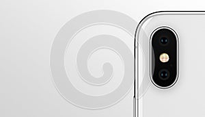 Closeup white smartphone similar to iPhone X dual camera module on gray background banner with copyspace