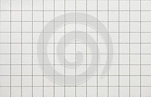 Closeup of white squared paper sheet background