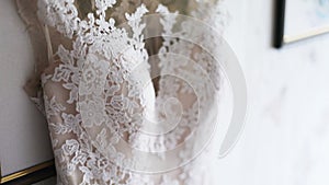 Closeup of white wedding dress