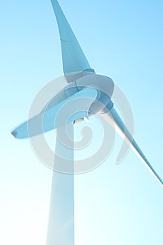 Closeup wind turbines, wind power blue sky background, design architecture, Mobile phone wallpaper, vertical photo