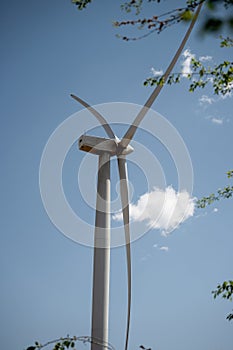 Closeup of windmills in the field on a sunny day. Wind turbines in Argentina. vertical photo