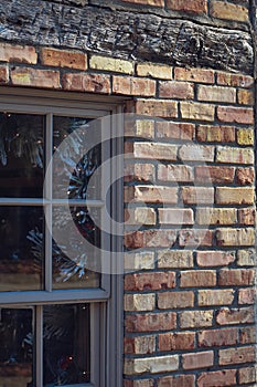 Closeup of Window, Brick, and Log Beam