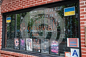 Closeup on the window and sign of The Stonewall Inn. Gay bar