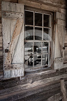 Closeup of windowpanes and shutters from civil war era log cabin in Callaway gardens in Georgia