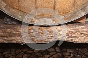 Closeup of Wine Barrel on an Old Wood Beam