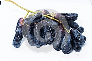 Closeup of Witch fingers grape on white background