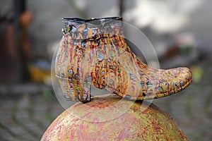 Closeup of a woman boat covered painted with different colors