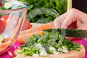 Closeup on woman cutting fresh greenery