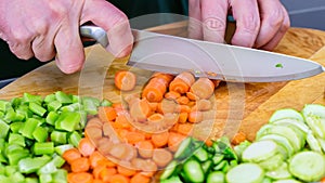 Closeup on woman cutting vegetables in the kitchen. Healthy eating concept