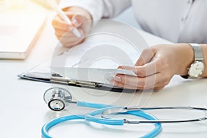 Closeup of woman doctor`s hand in office