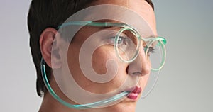 Closeup of woman drinking use straw glasses with blue limonade