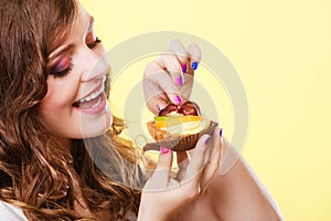 Closeup woman eating fruit cake sweet food