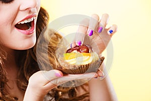 Closeup woman eating fruit cake sweet food